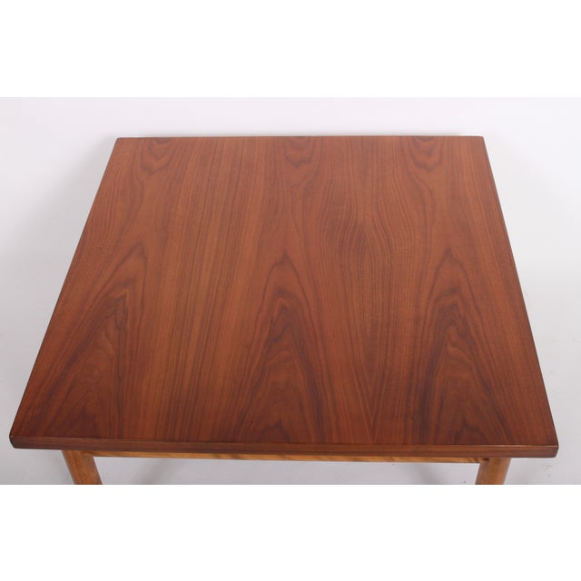Robsjohn Gibbings for Widdicomb square mahogany side table. Featuring a solid board surface, detailed with a turned...