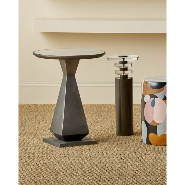 The Janil Accent Table is a generously sized side table forged from cast aluminum with a handsome graphite finish. The...