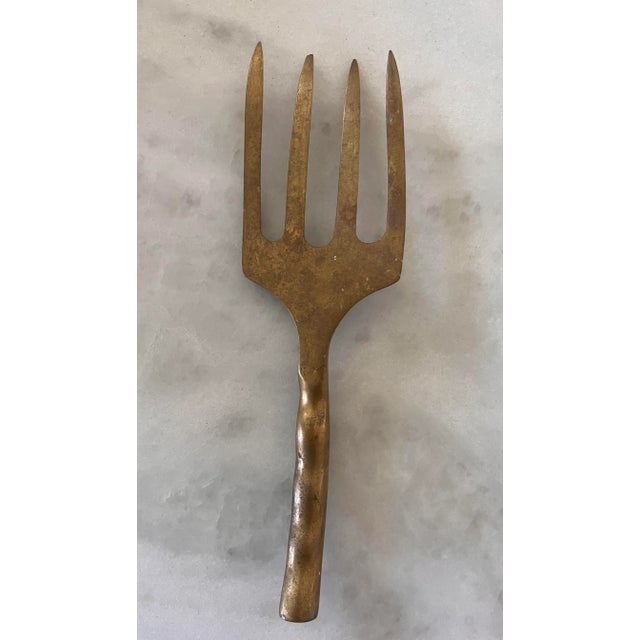 Vintage solid brass large 4 prong fork. Possibly a garden tool in a form life, but would be a nice object of...