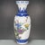 A beautiful pair of Chinese porcelain vases. The white ground is decorated with vibrant Famille Rose enamels, featuring...