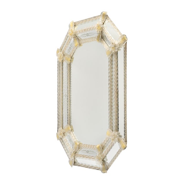 An elegant Venetian glass mirror, circa 1940, distinguished by its refined octagonal silhouette and delicate hand-worked...