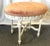 Precious vintage French style vanity stool. It's made of wood with carved bow details on the apron, fluted legs, and...