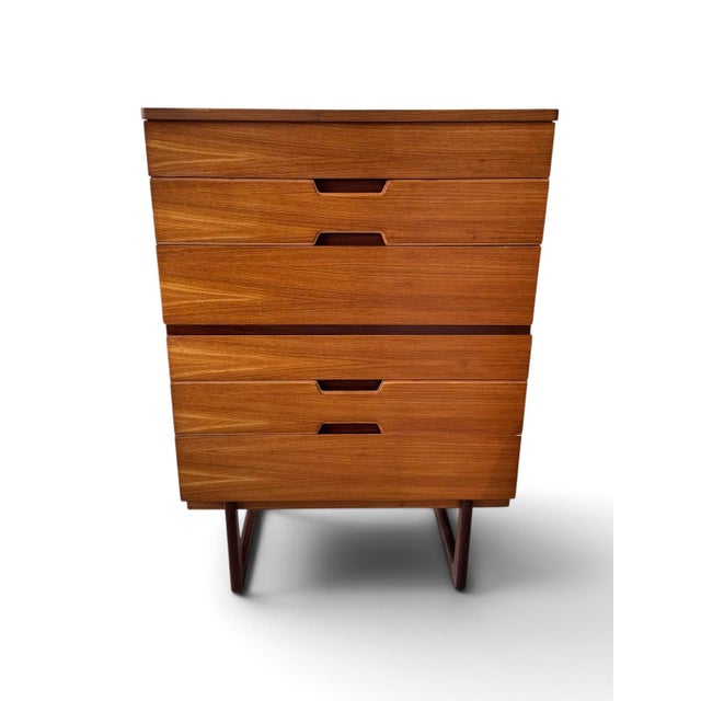 A striking mid-century British tallboy chest of drawers, designed by Gunther Hoffstead for Uniflex circa 1960. Beautifully...