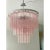 Contemporary pink “tronchi” murano glass chandelier with a chromed belt. “tronchi”are blown inside a wooden mold, into...