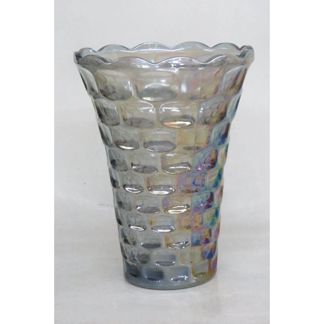 This beautiful vase is made of carnival glass. This vase is made in the Yorktown pattern used by Federal Glass; it...