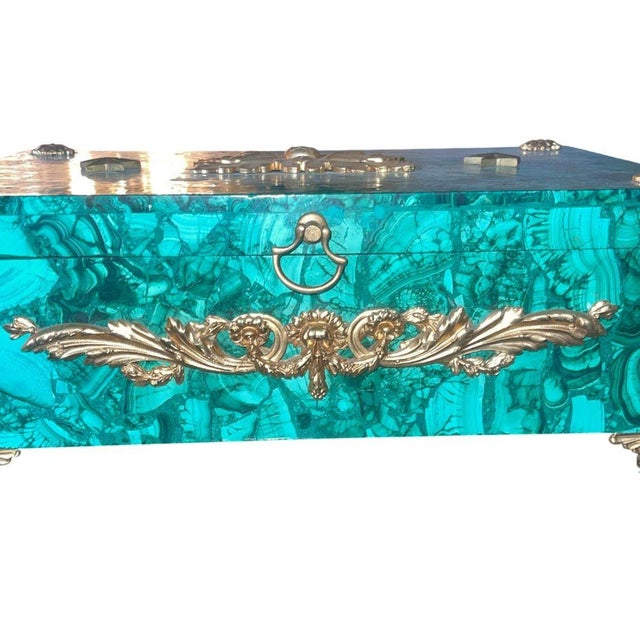 Elegant Russian decorative box crafted in richly patterned malachite and adorned with finely cast gilt bronze mounts,...