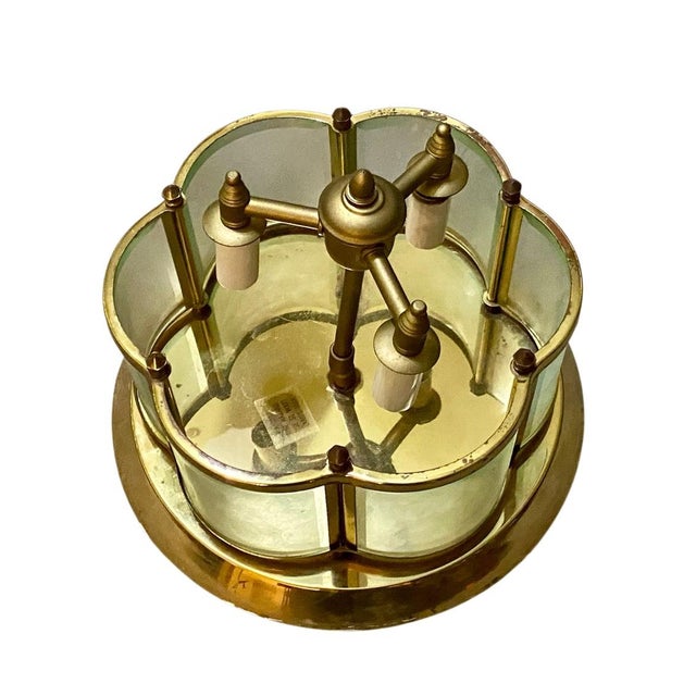 10.5” across 7” tall good condition Discover the enduring beauty and quality of this vintage solid brass and glass ceiling...