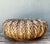 This vintage handcrafted rattan centerpiece is a generously scaled woven basket that brings natural texture and relaxed...