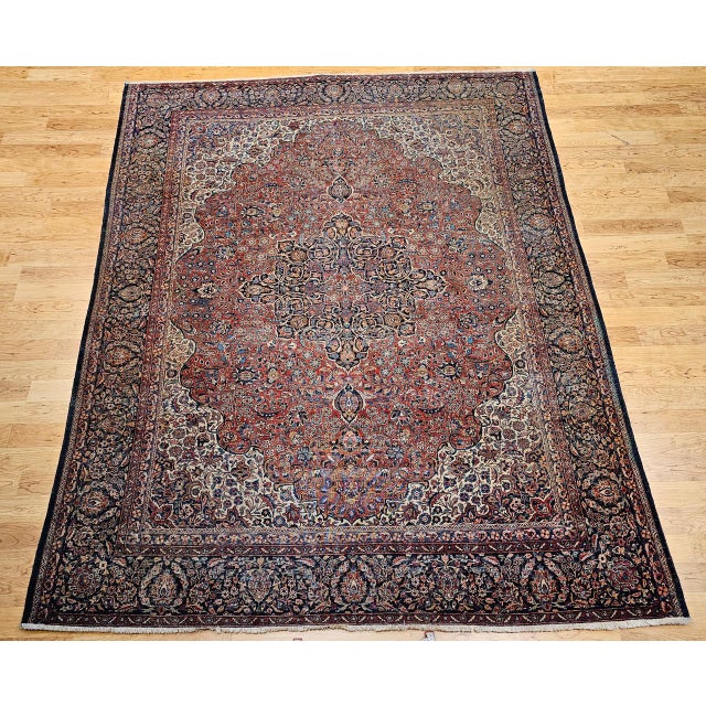 "Discover the enduring splendor of early 20th-century Persian weaving with this magnificent room-size Persian Kashan rug....