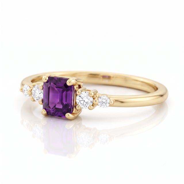 Elevate your everyday look with the regal charm of deep, vivid violet. This captivating piece holds a central eye-clean...