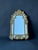 A very elegant Regency-style mirror with carved and gilded wooden side panels, likely dating from the 1930s. Its rich...