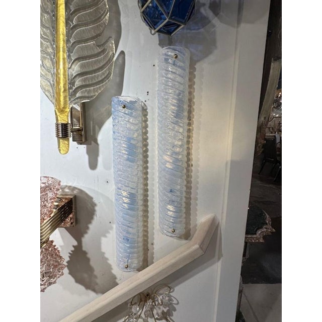 Pair of modern Murano swirl opalescent glass barrel sconces. The sconces have been professionally rewired and ready to hang.
