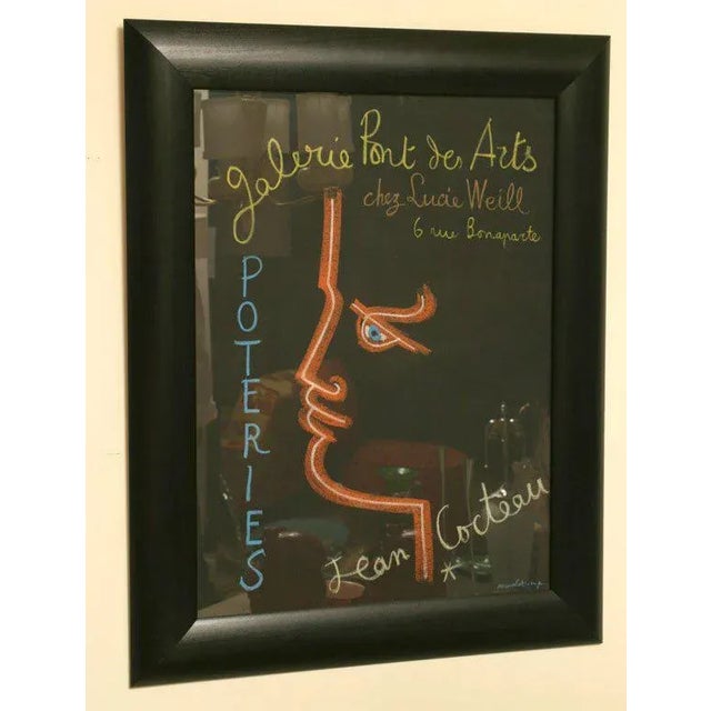 This original and authentic mid century french stone lithograph poster was designed by Jean Cocteau from the 50's is for a...