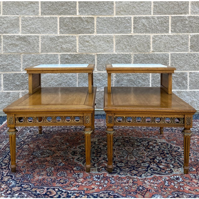 A pair of vintage Gordon's Fine Furniture French Louis XVI walnut step back side tables having inset marble tops with gold...