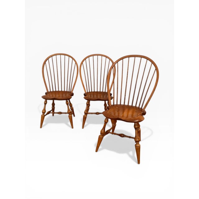 A charming set of three handcrafted Windsor dining chairs by D.R. Dimes, a respected New Hampshire maker known for...