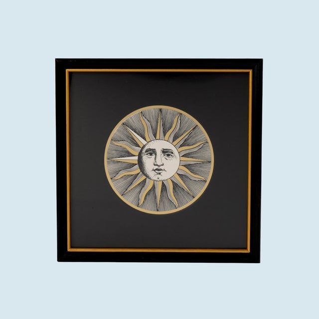 Vintage framed etching from Piero Fornasetti's iconic Soli e Lune series, featuring the distinctive Sole VI sun motif....
