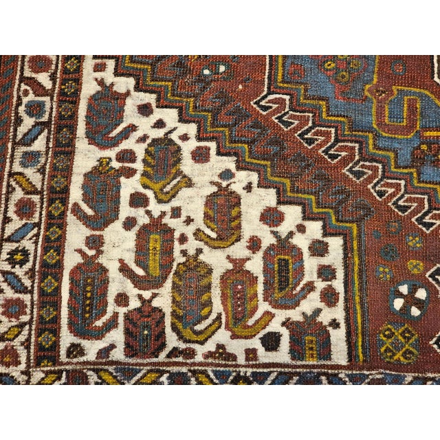 A beautiful early 20th century Persian Qashqai tribal area rug of great visual boldness and cultural authenticity — hand-...