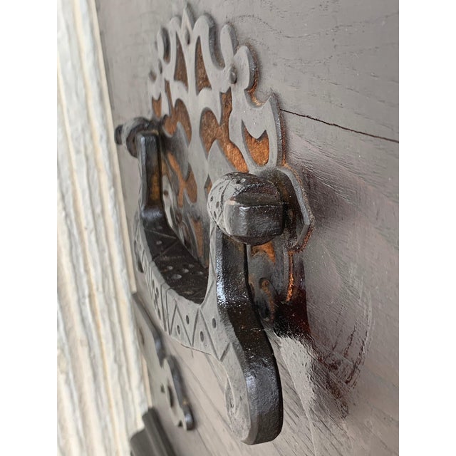 Having a hinged top and raised on shaped bracket feet, 19th Spanish Baroque Walnut Trunk with Handcarved Decoration with...