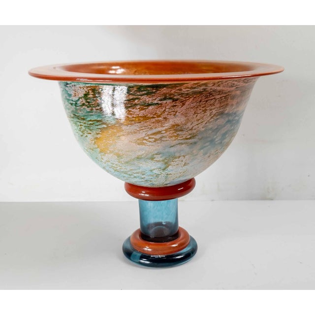 We are selling this colorful Art Glass bowl by Kjell Engman for Kosta Boda. This large bowl has bright vivid colors and...