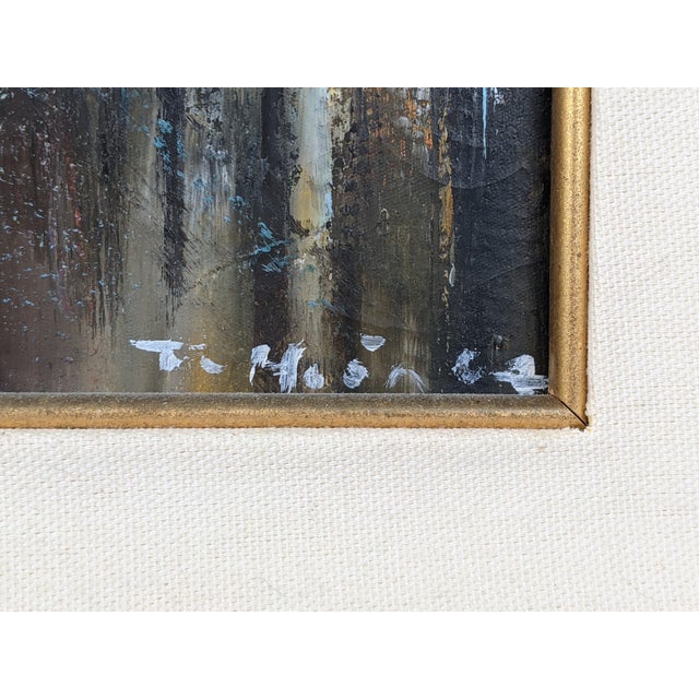 An exceptionally striking mid-20th-century Vietnamese oil painting depicting a canal lined with closely clustered stilt...