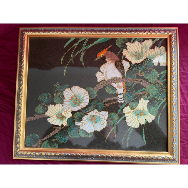 A lovely pair of difficult to find lava stone style imported Asian artworks. Vibrant birds and vegetation. Nicely framed...