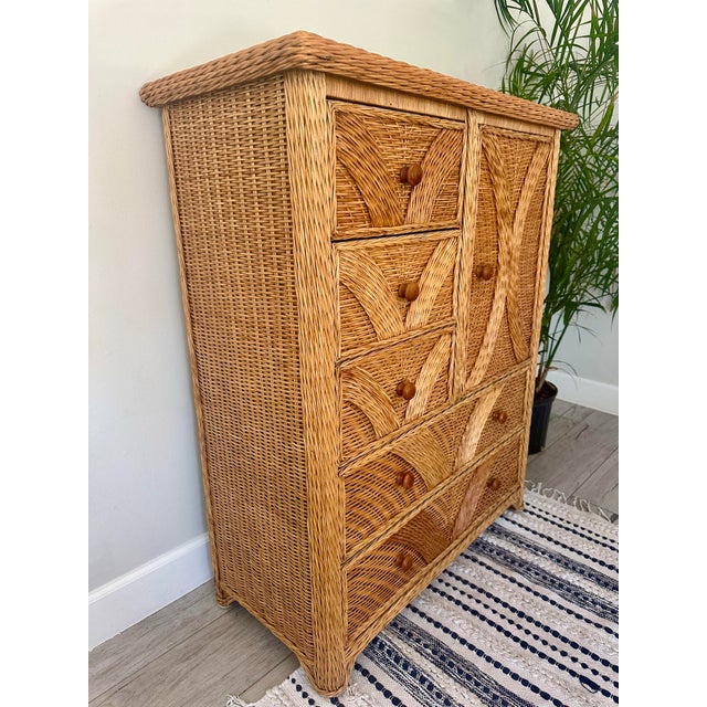Beautiful vintage wicker tall chest of drawers. Excellent condition! Warm color. Detailed weaving. Wooden pulls. Roll out...