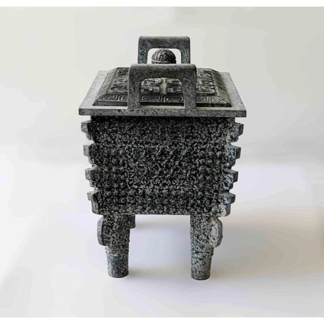 Vintage James Mont-style Shang Bronze Fang Ding ice bucket, featuring an intricate Asian-inspired cast aluminum design....