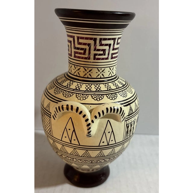 This vintage Greek hand-made ceramic vase features a striking geometrical design inspired by traditional Mediterranean...