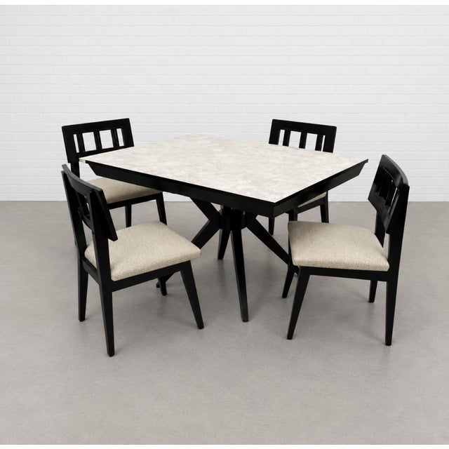 atching set of four dining chairs. The table features a dramatic spider leg base and a rich two-tone design—its black...