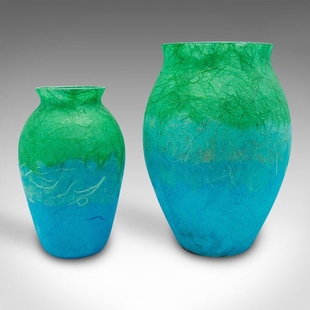 This is a contemporary flower vase duo. An English, art glass and straw silk baluster urn set, by Margaret Johnson....
