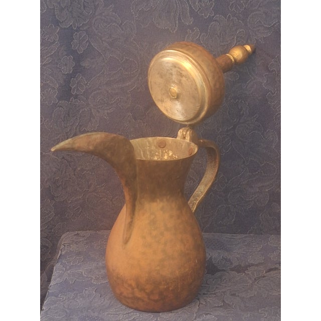 Bring warmth, character, and global craftsmanship to your collection with this striking traditional Middle Eastern dallah...
