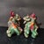 Add a bold and auspicious statement to your space with this striking pair of vintage Shiwan Kiln glazed ceramic mythical...