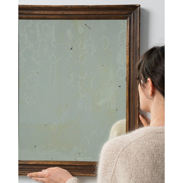 Here is a mirror, its dark wood frame, sage green aged glass the first thing to catch the eye. Dating to 19th Century and...