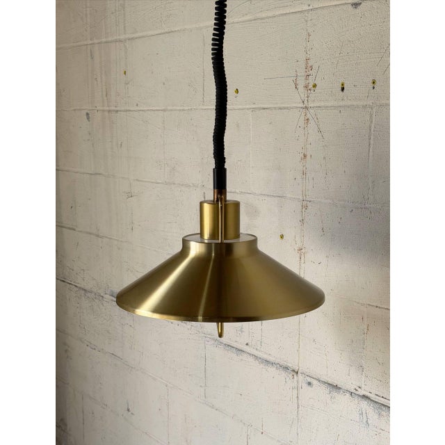 Featuring a flared metal shade with an upper wire accent frame, this pendant fixture directs warm downward illumination....