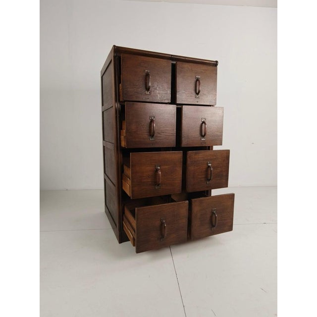 Beautiful solid oak double archive cabinet from the Netherlands, dating circa 1920–1940 . This piece features its original...