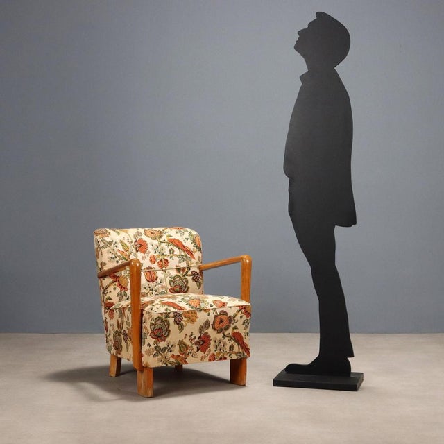 Special armchair with spring padding, beech wood. This piece is attributed to the mentioned designer/maker. It has no...