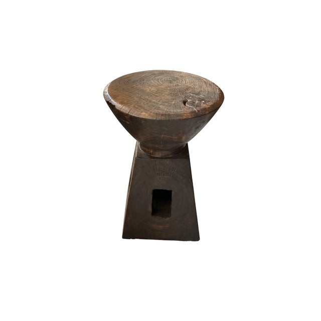 A wonderfully sculptural side table. It has an espresso finish (color resemblance to coffee). The wood pigment was...