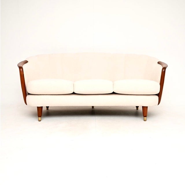 An incredibly beautiful and extremely well made vintage Swedish cocktail sofa. This was recently imported from Sweden, it...