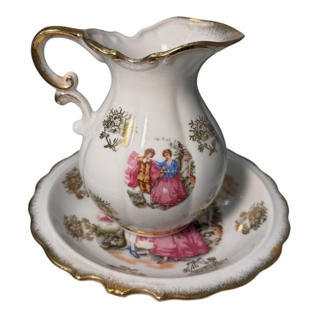 Beautiful vintage porcelain creamer with matching underplate/saucer, made in Japan. Features a Victorian courting couple...