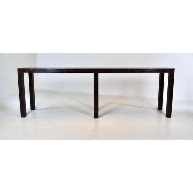 1970's Parson’s console table in striking Burl Tortoise shell laminate attributed to Milo Baughman. Generous proportions...