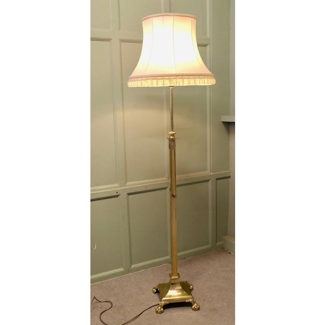 Very Tall Telescopic Brass Floor Lamp This is a good heavy quality piece, the base has very square lines with stylised...