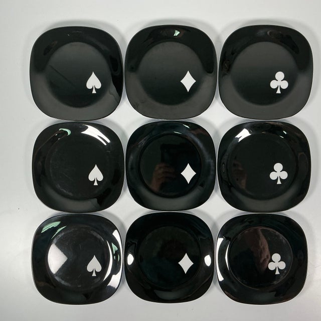 We actually have 10 of these plates with a 4th Club. The square Melamine plates are solid black with either a deck of...