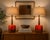 A striking pair of mid-century modern ceramic table lamps attributed to Poole Pottery, featuring richly expressive lava...