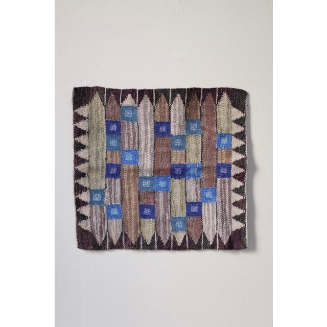 Swedish Mid-Century Tapestry in a geometric design in blue, brown, dark purple and green shades. Very good condition with...