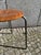 Beautiful mid-century stool with a mahogany seat and steel legs. "Made in Denmark" is engraved on the underside. The stool...