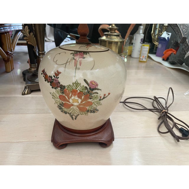 Bring a touch of classic mid-century elegance to your home with this beautiful vintage Japanese table lamp. The base is...