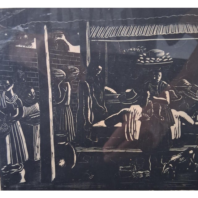 A captivating woodblock of a local marketplace by the Costa Rican master. Image size is 7" H x 8: W. Original frame, under...