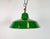 Industrial green enamel pendant light made by Revo in United Kingdom during the 1950s. White enamel inside the shade....