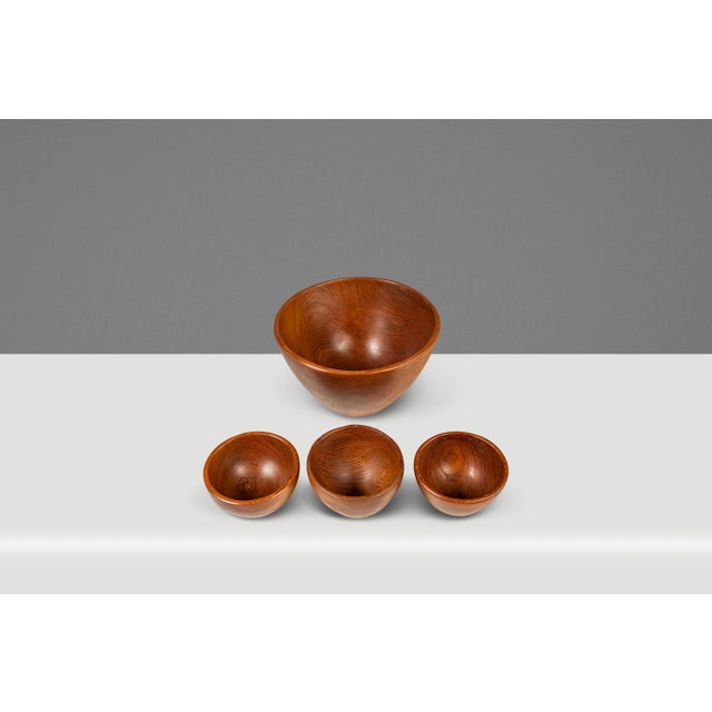 Introducing a gorgeous, hand-turned and hand-polished set of four serving bowls carved from solid Burmese teak wood....