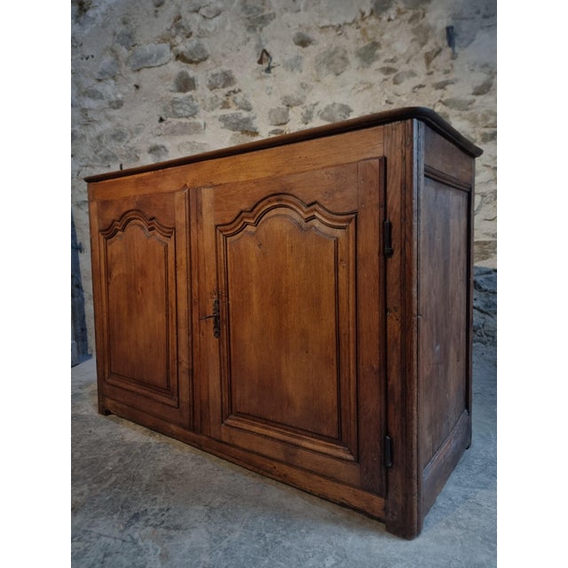Antique French two-door cabinet dating from the 18th century, originating from the Auvergne region of France. Crafted from...
